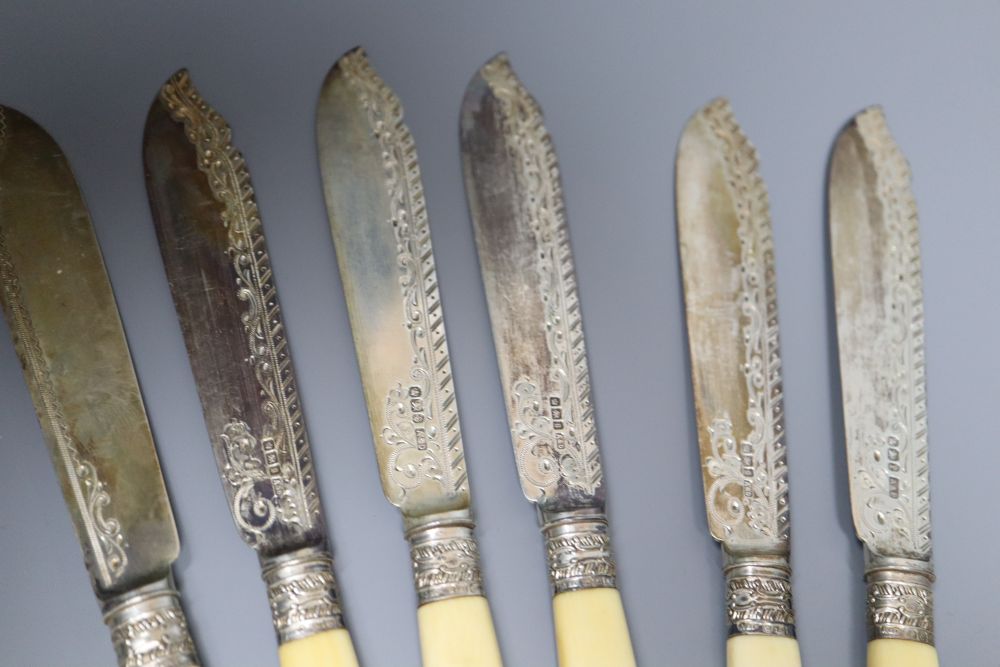 A pair of Edwardian silver ivory handled fish servers by Mappin & Webb, six pairs of ivory handled silver dessert eaters, etc.